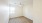 a room with a wood floor and a window