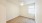 a room with a wood floor and a window