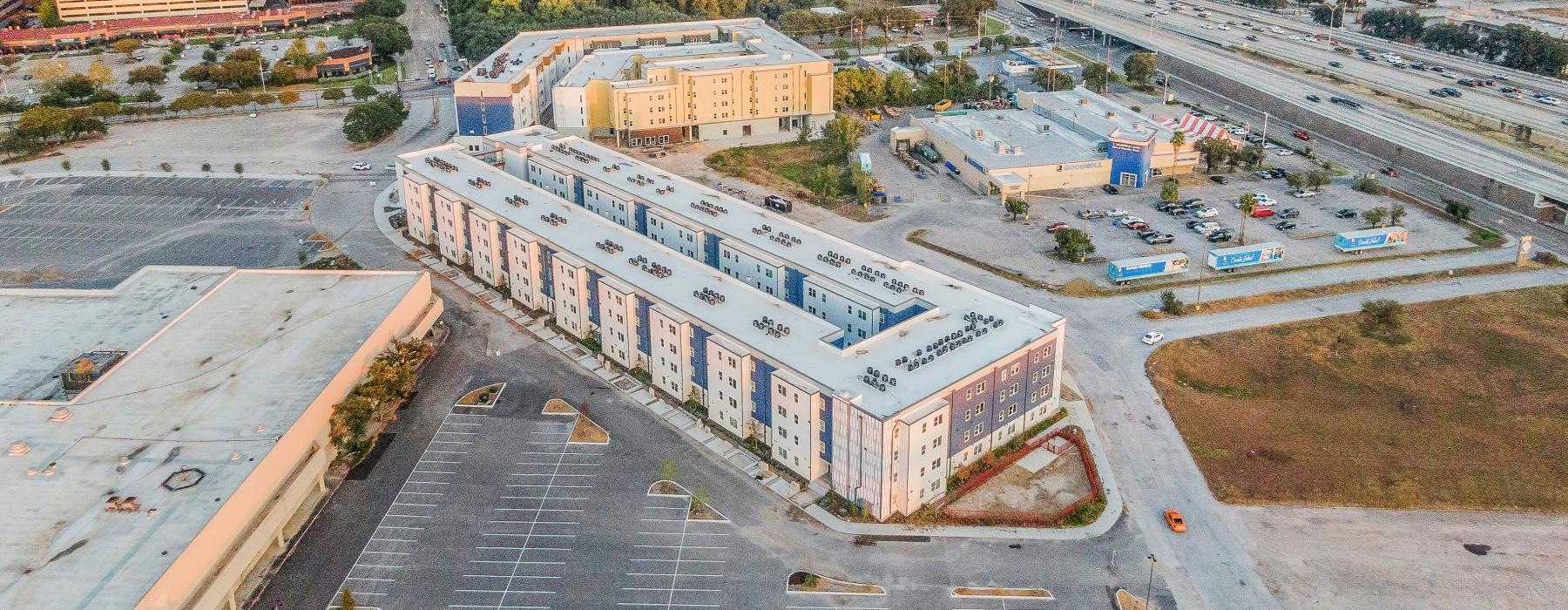 a large building with a parking lot
