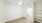 a room with a wood floor and a ceiling fan